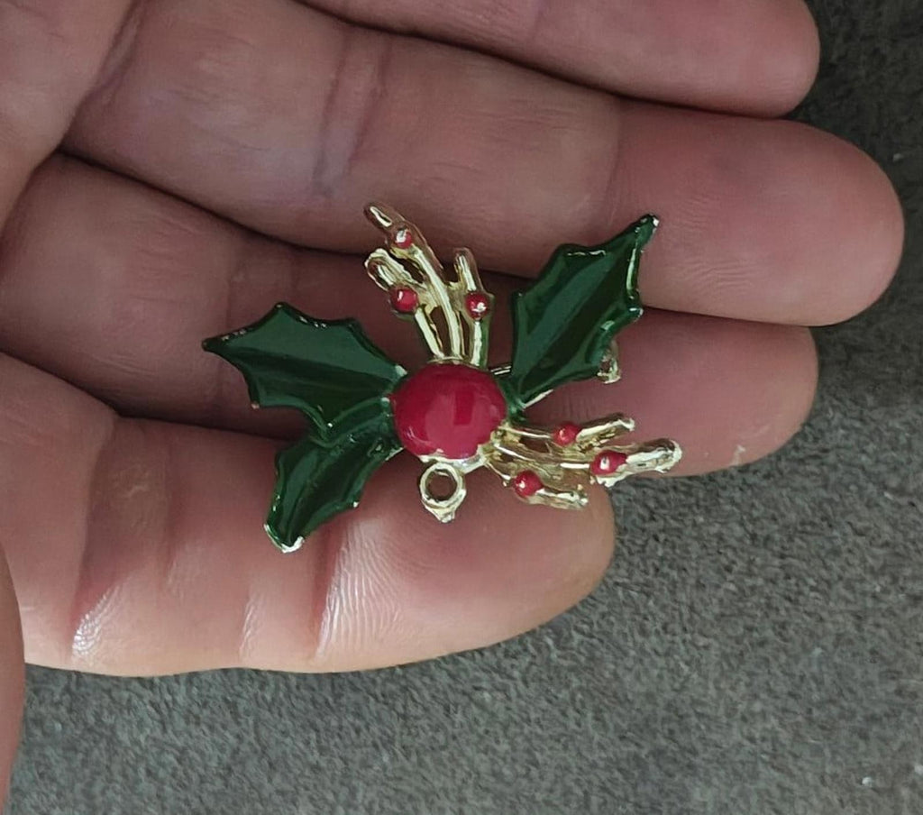 Green holly enamel brooch pin with red berry centerpiece and gold-tone top detailing