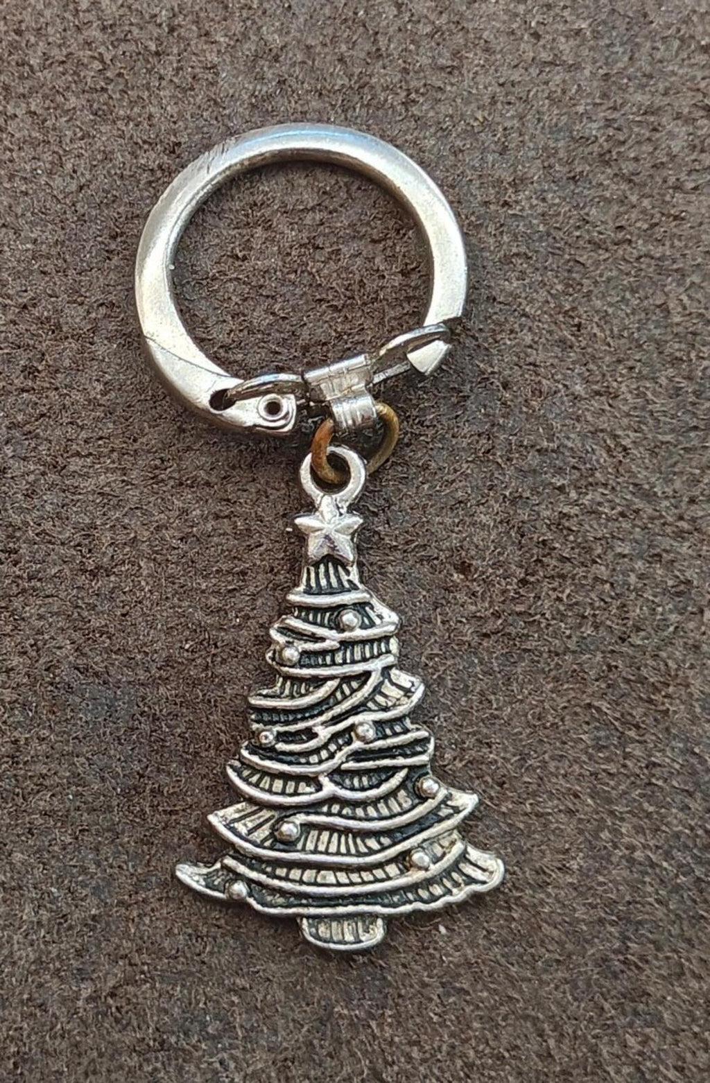 Silver Christmas tree keychain charm with star topper and textured tree layers