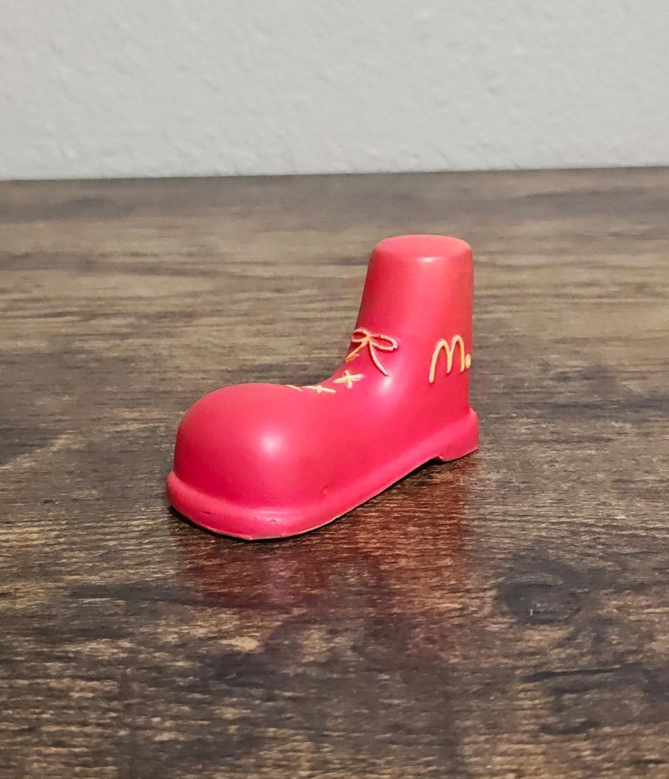 Red shoe antenna topper figurine side view with gold McDonald's logo and bow
