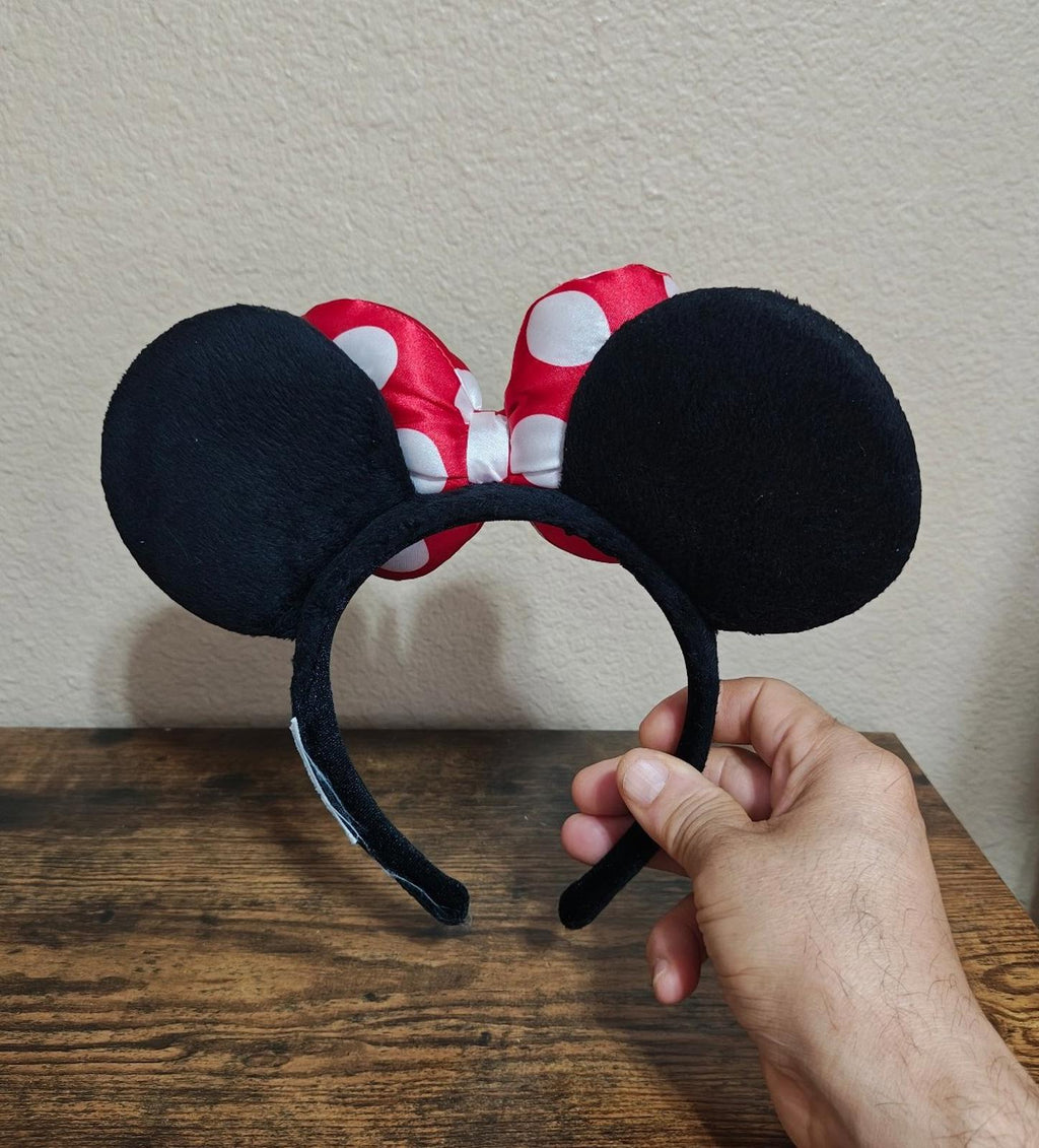 Front bow ear headband with red and white polka-dot bows and black fabric ears