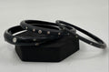Black lucite bangle set with crystal stud embellishments, three bracelets