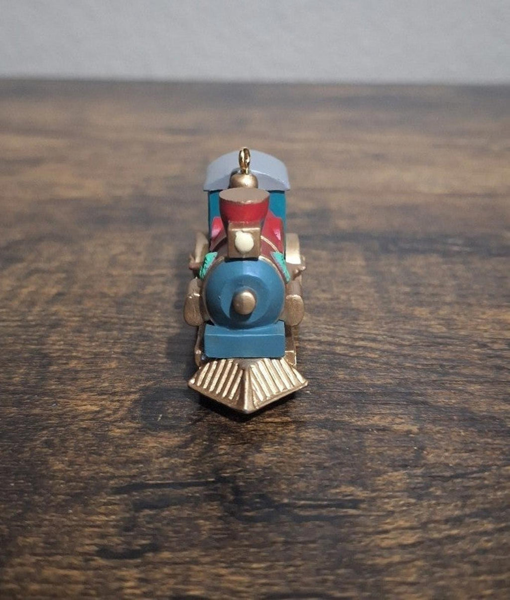 Blue train locomotive ornament, rear view with red top smokestack and hanging loop