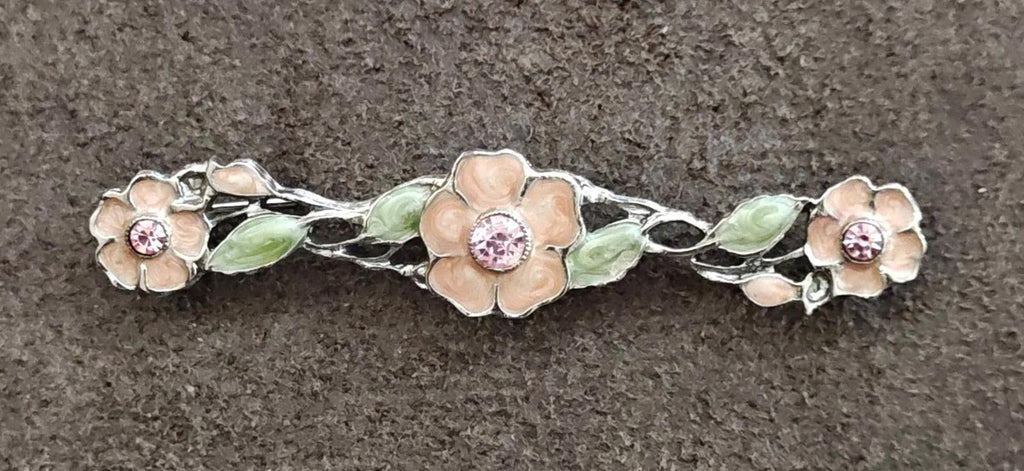 Floral bar brooch, green enamel leaves and pink stones on silver-tone floral frame