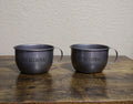 Set of two dark stainless steel mugs with side handles and USP ALCATRAZ print