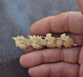 Gold tone leaf and flower rhinestone brooch pin with small round crystal accents