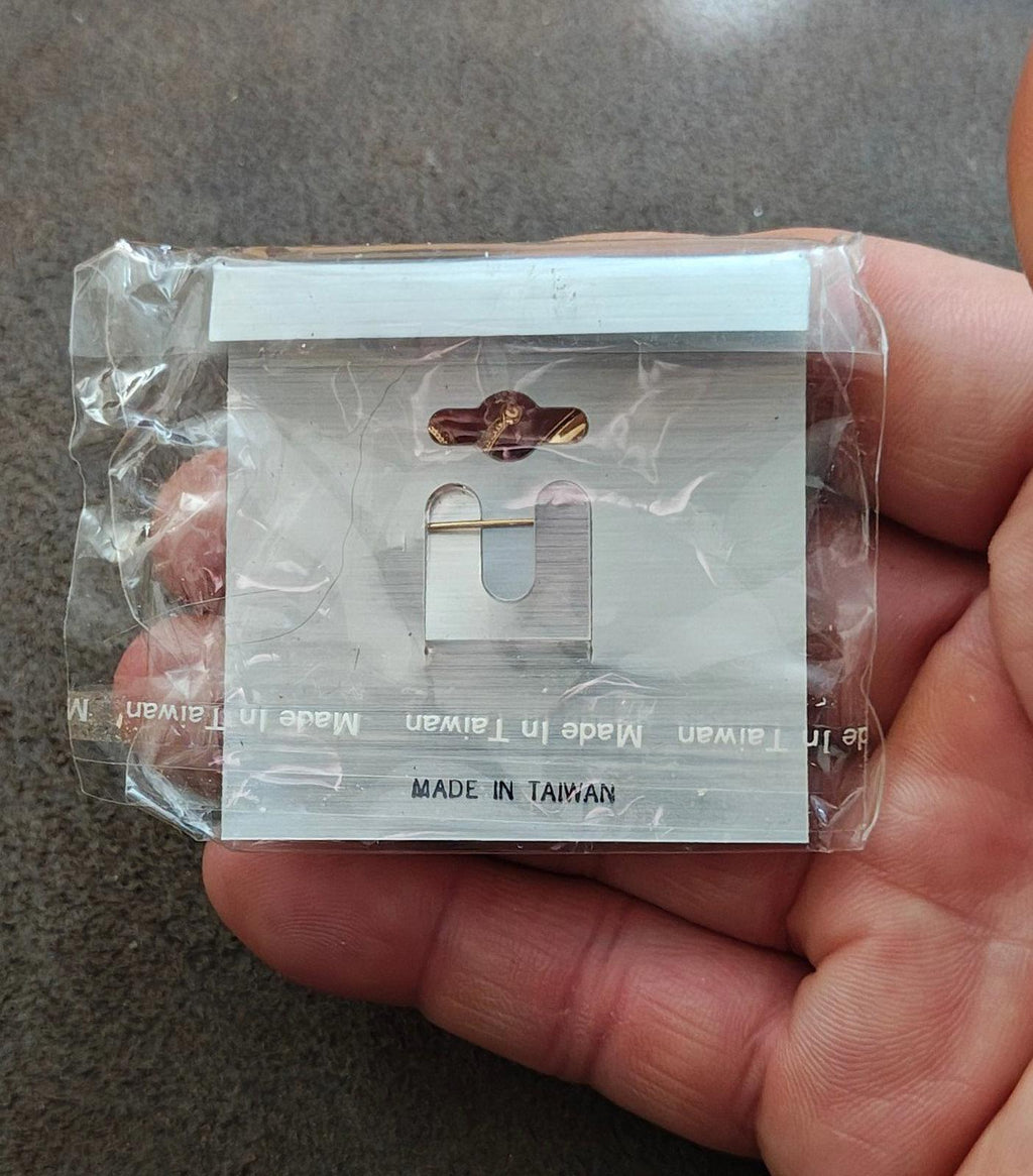 Butterfly brooch clasp backing on card, with metal pin and secure hook