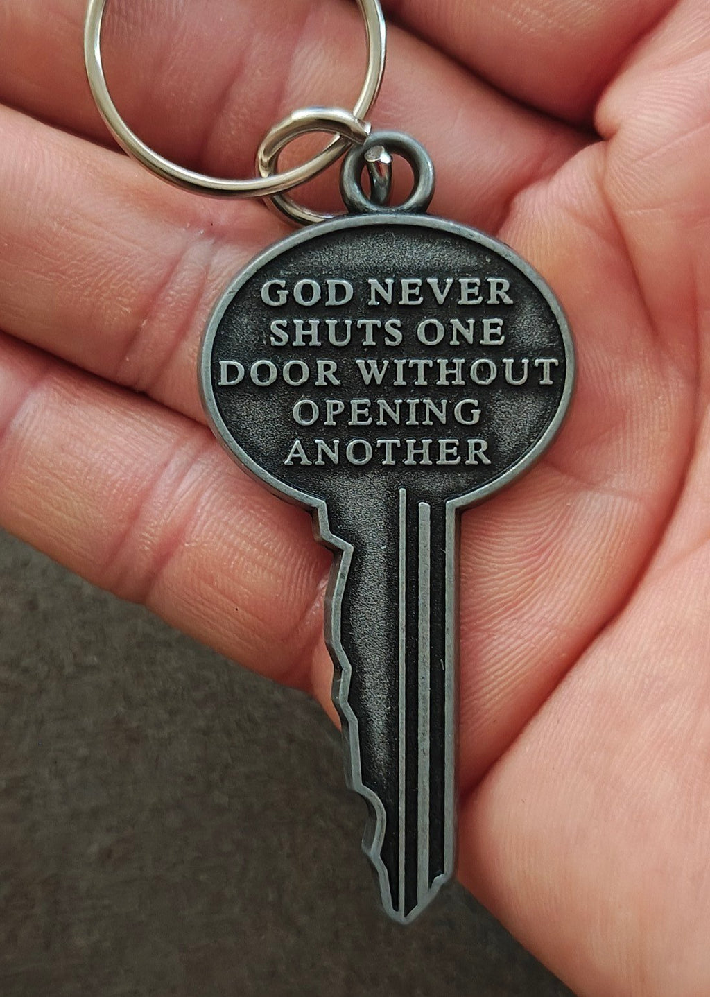 "God never shuts one door without opening another." Cast Metal Keychain