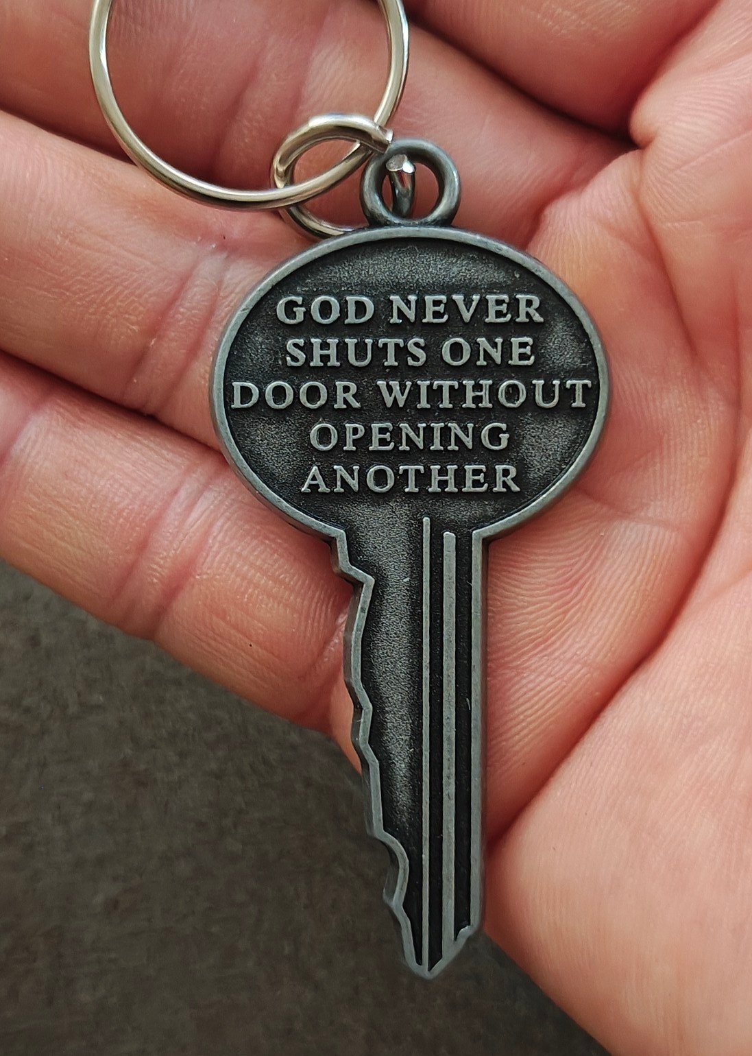 "God never shuts one door without opening another." Cast Metal Keychain