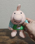 Green rabbit bean bag plush with smiling face and blue checkered sleeves