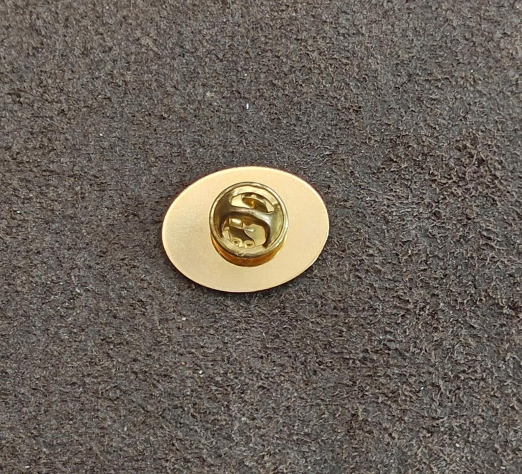 Round gold pin back with clasp and post