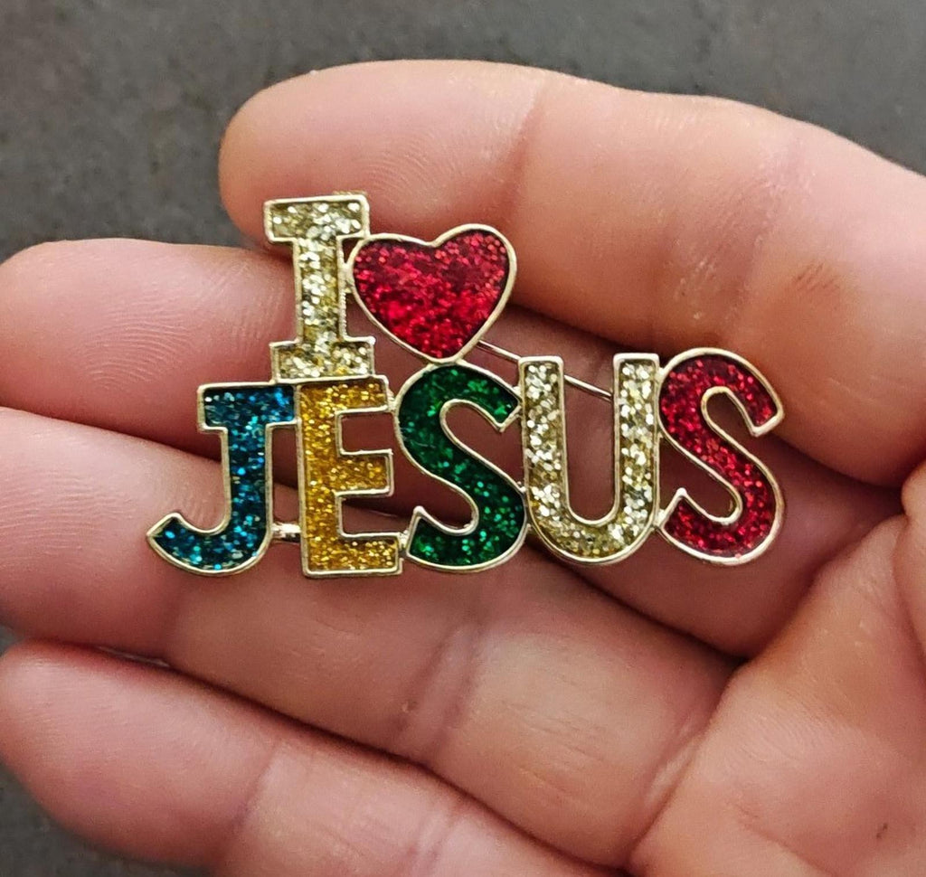 Rainbow glitter enamel Jesus heart brooch pin close-up in hand