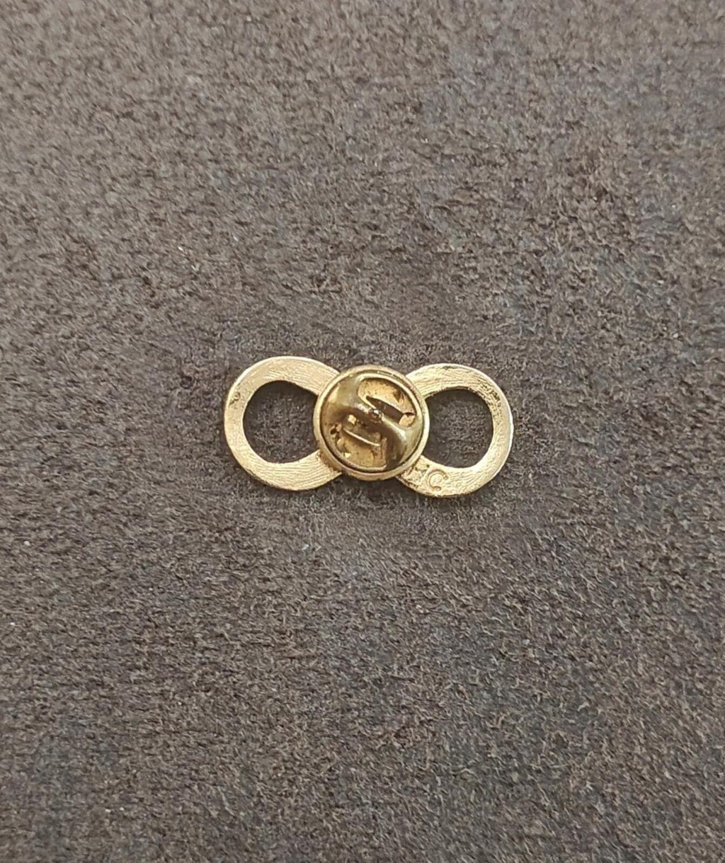 Gold infinity brooch clasp backing with circular pin mechanism