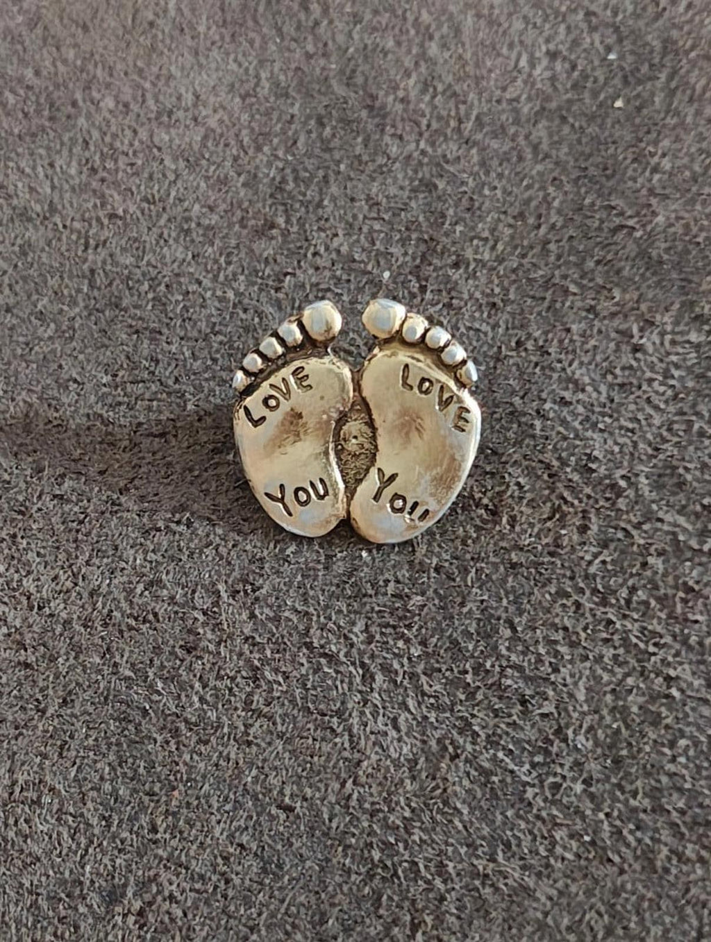 Gold-tone double footprint brooch pin, full front view with "LOVE" and "YOU" words