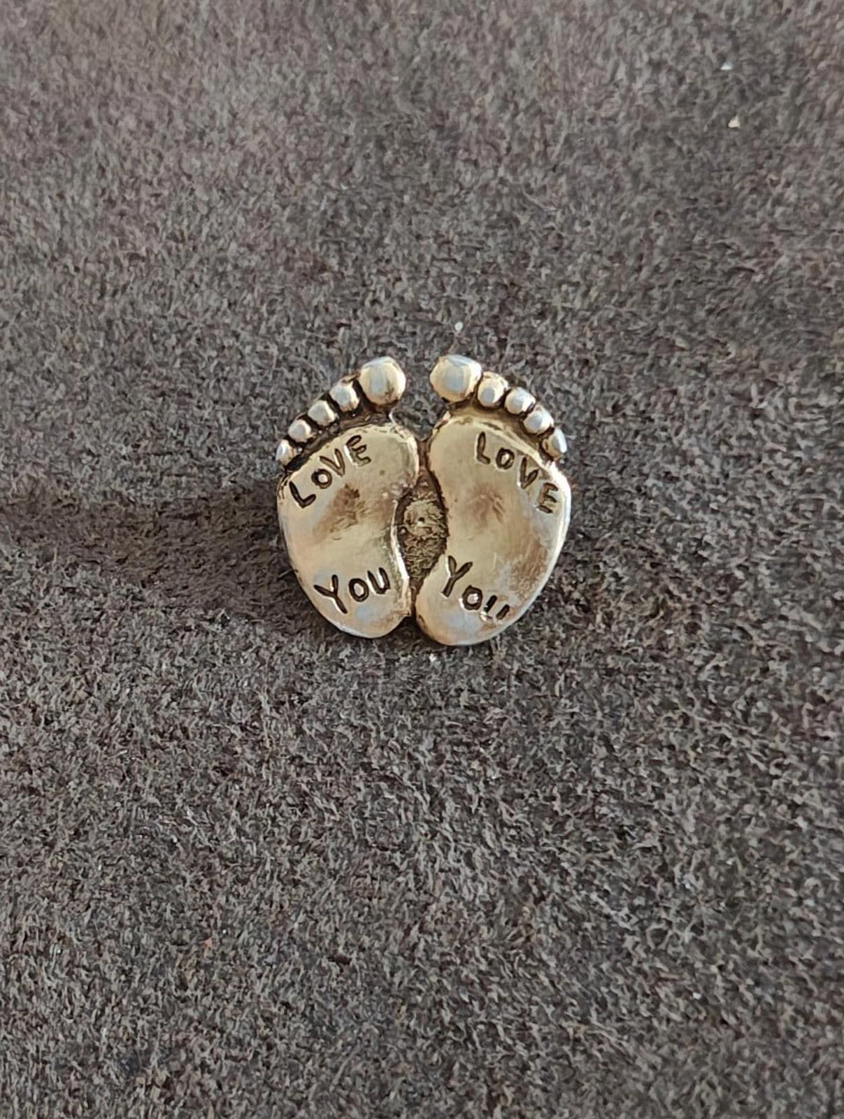 Gold-tone double footprint brooch pin, full front view with "LOVE" and "YOU" words