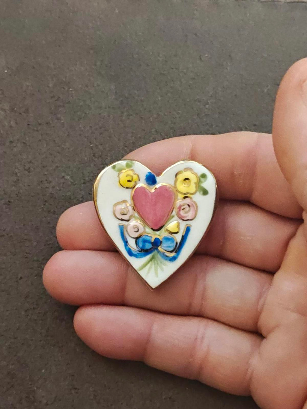 Heart-shaped ceramic brooch pin with pink heart and blue ribbon floral detail