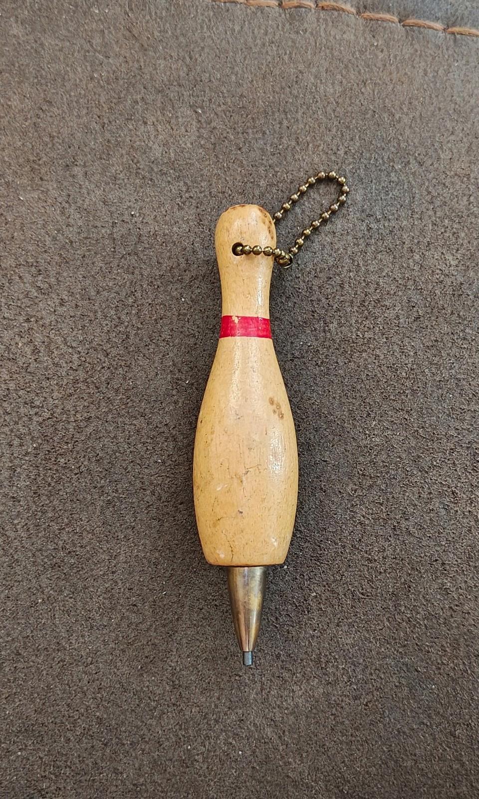 Beige wooden bowling pin mechanical pencil keychain with red band and bead chain loop