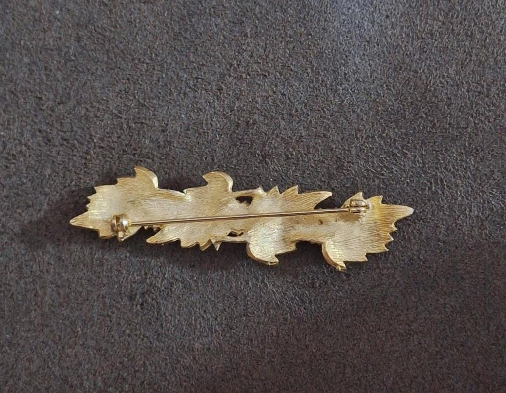 Gold tone leaf brooch pin back view with hinge bar and clasp hardware