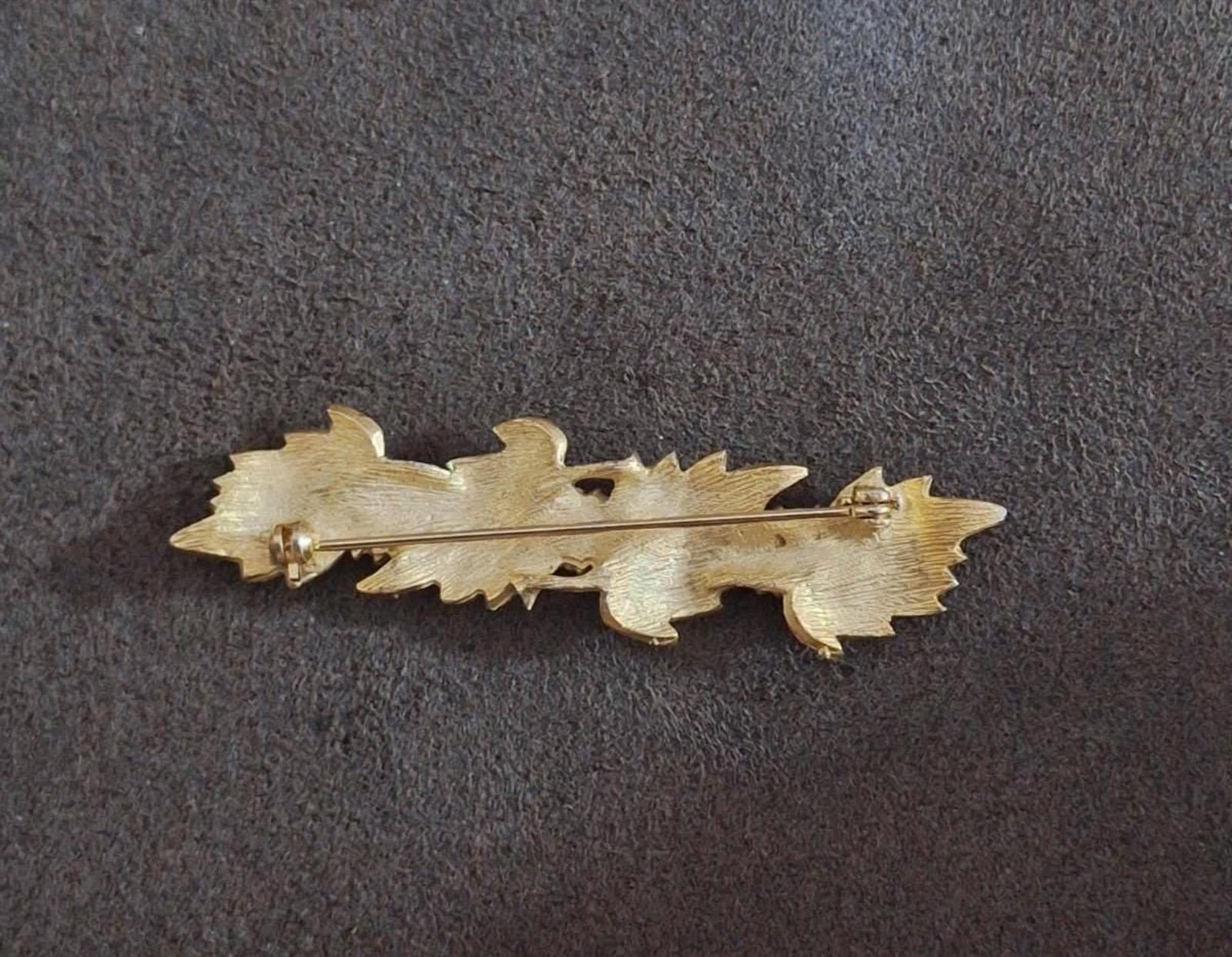 Gold tone leaf brooch pin back view with hinge bar and clasp hardware