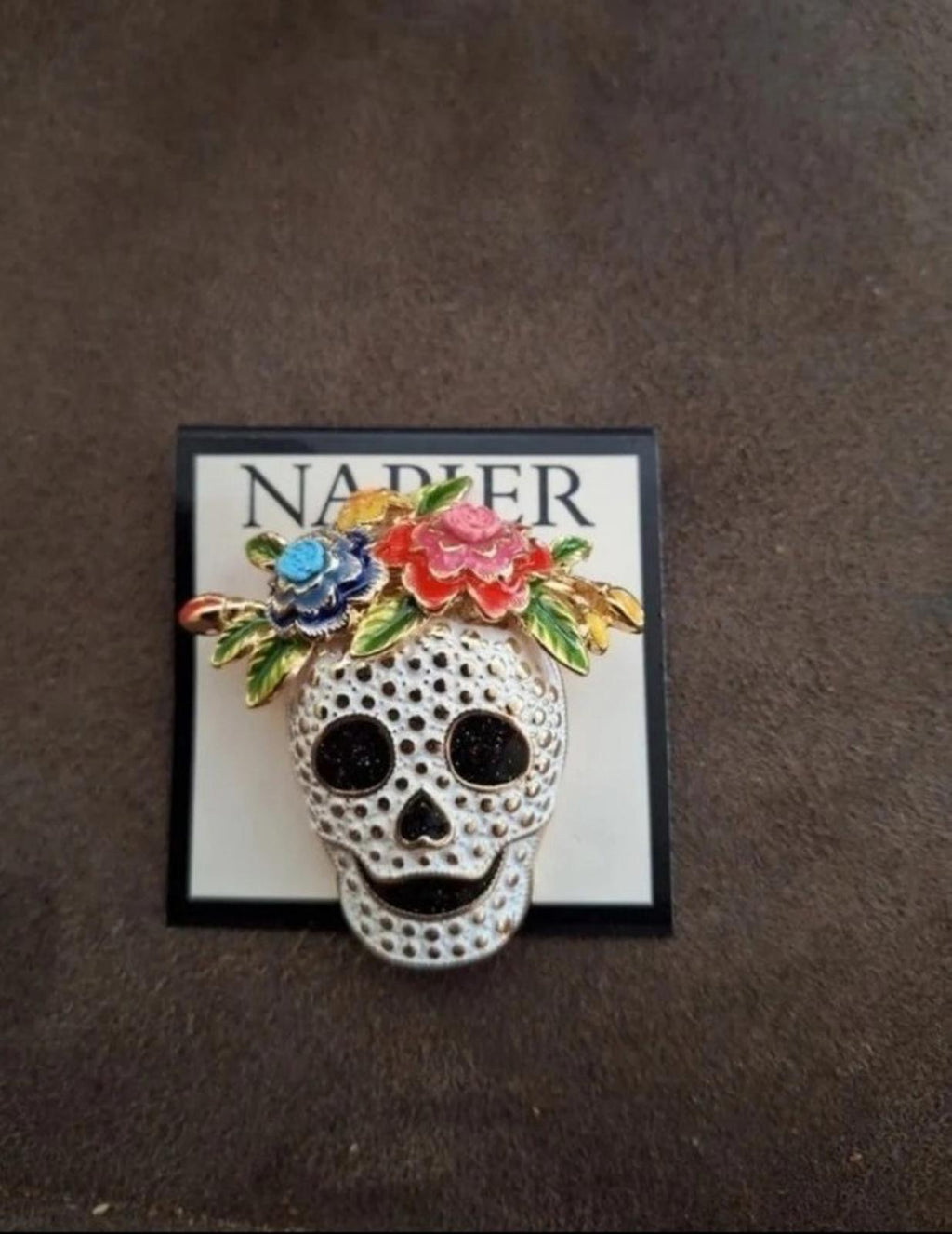 Silver tone sugar skull pin with colorful flowers and black eye details