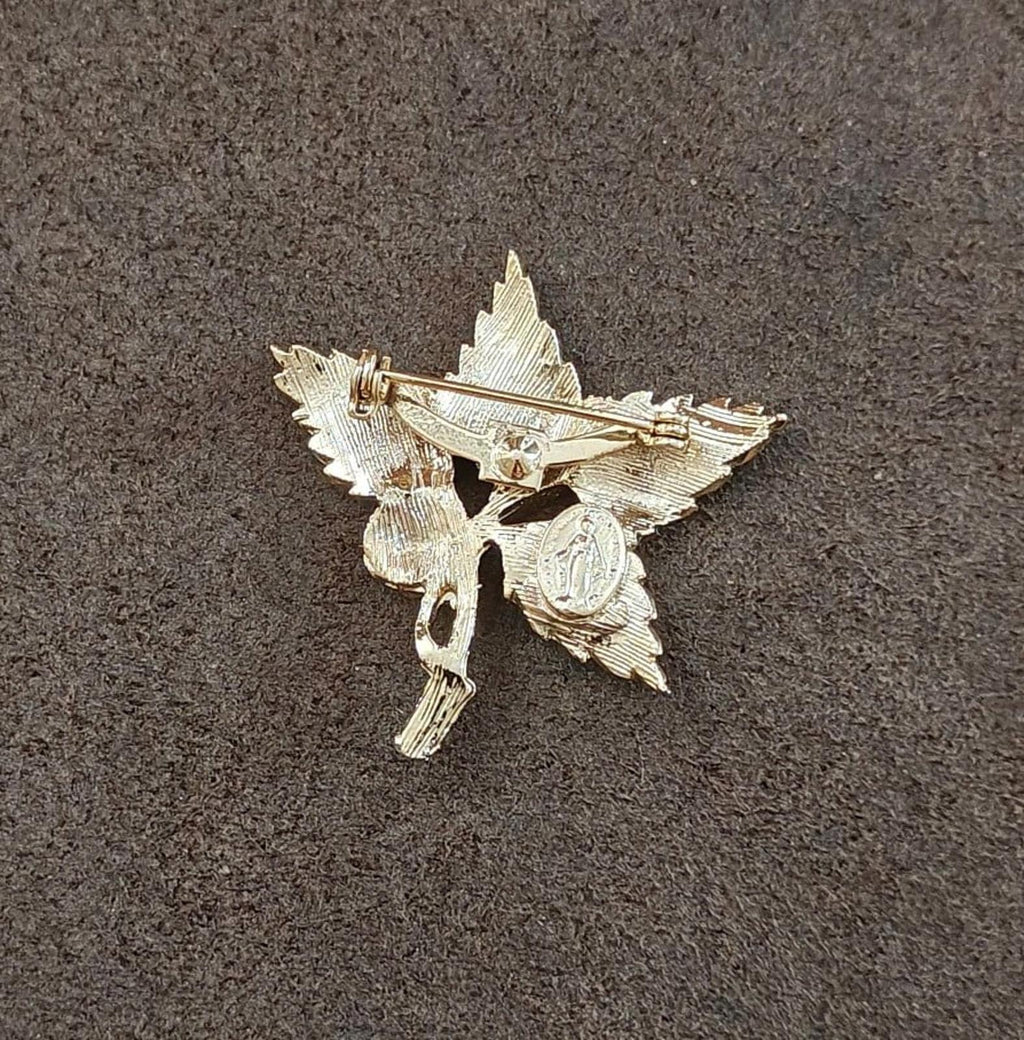 Gold-tone leaf cross pin brooch back view with safety clasp and loop