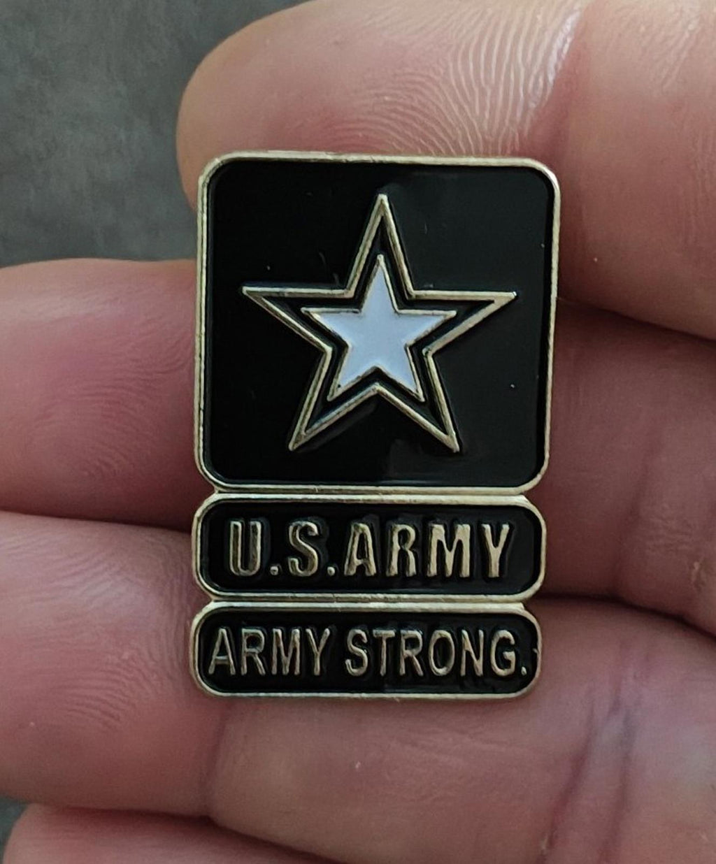 Black enamel U.S. Army star lapel pin with U.S. ARMY and ARMY STRONG