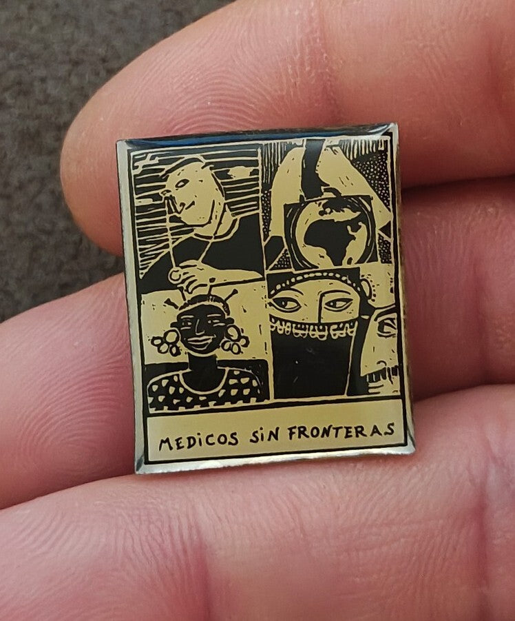 1990s Médicos Sin Fronteras (Doctors Without Borders) Silver Tone Enamel Pin