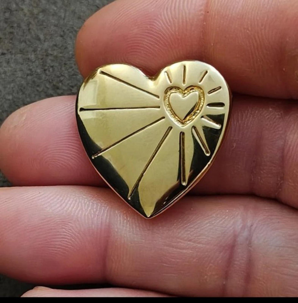 Gold tone 3D heart brooch pin with raised rays and small heart detail on front