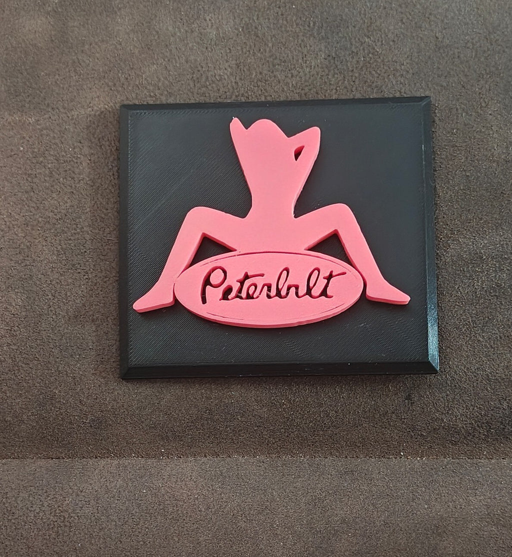 Pink and Black Peterbilt "Mudflap Girl" Emblem Hard Plastic Plaque