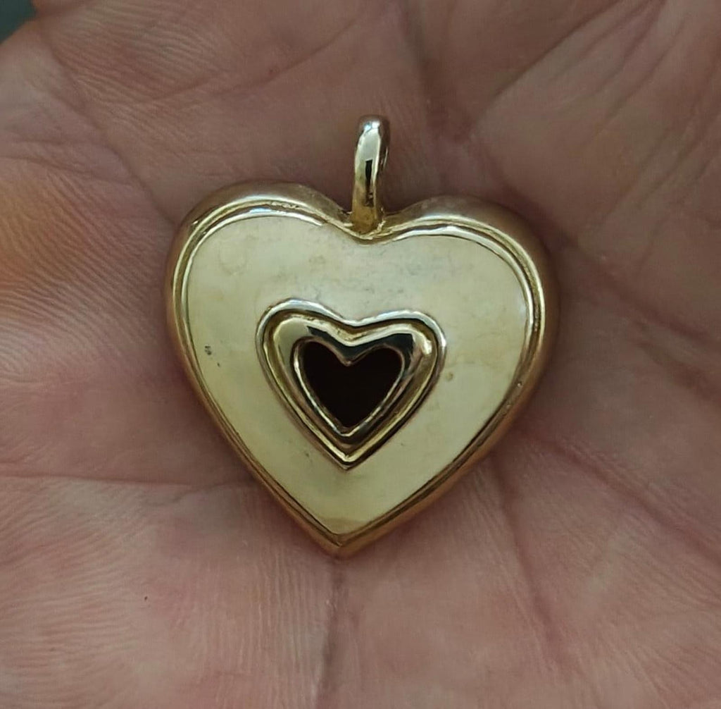 Gold tone heart pendant with white enamel front and black heart inset, open bail at top