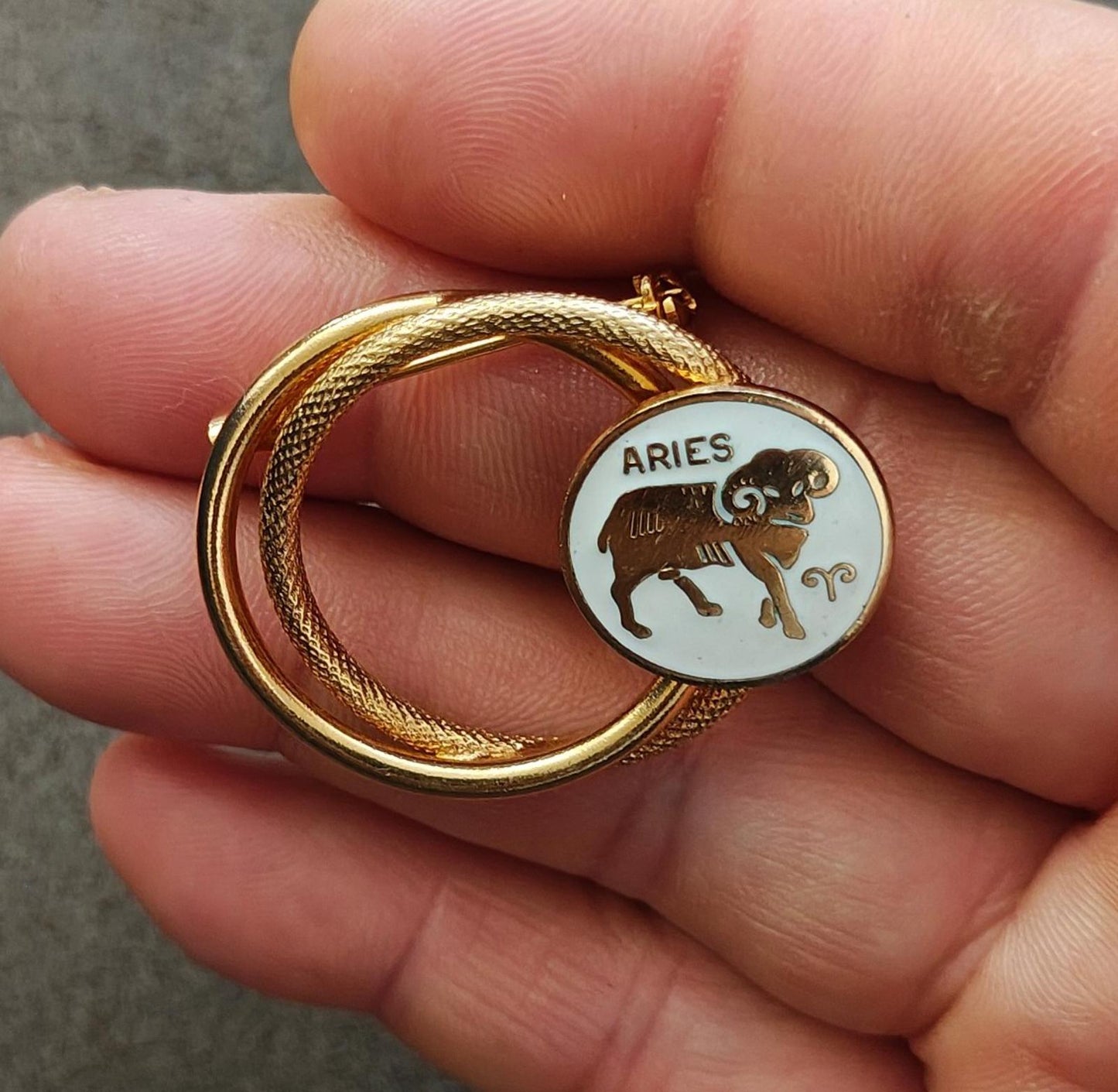 1970s Gold Tone Aries Zodiac Sign Double Circle White Enamel Brooch Pin