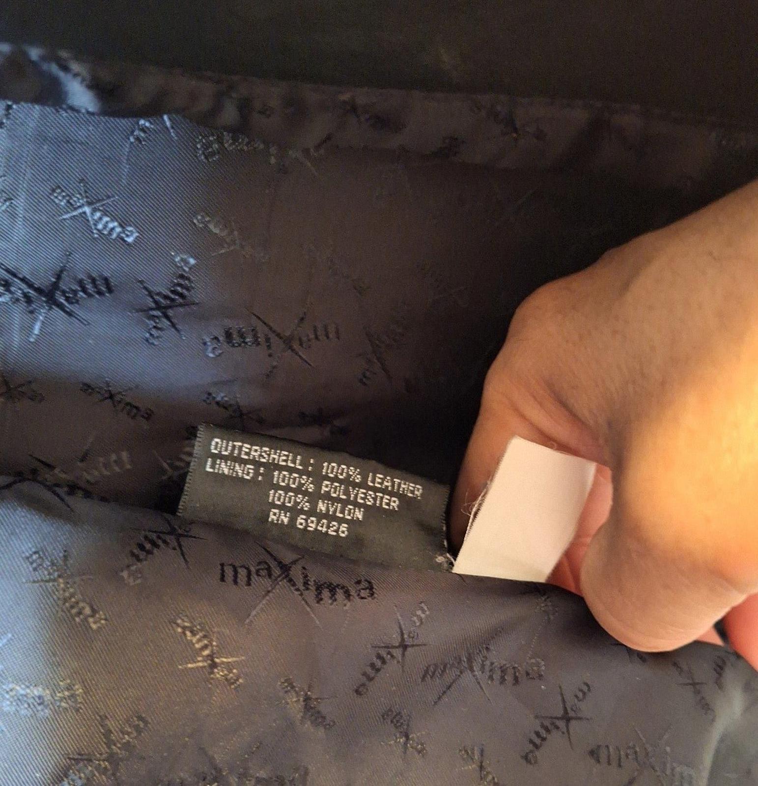 Inside care label: 100% leather outer shell and 100% nylon lining