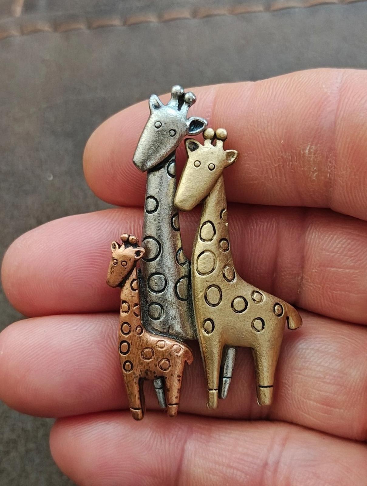 Tricolor giraffe family brooch with tall silver and gold giraffes plus small brown one