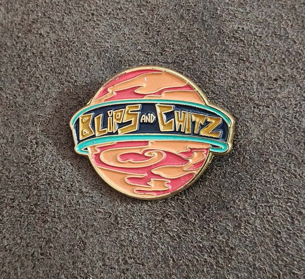 Funko Rick & Morty Blips & Chitz Exclusive Gold Tone Orange Enamel Pin.