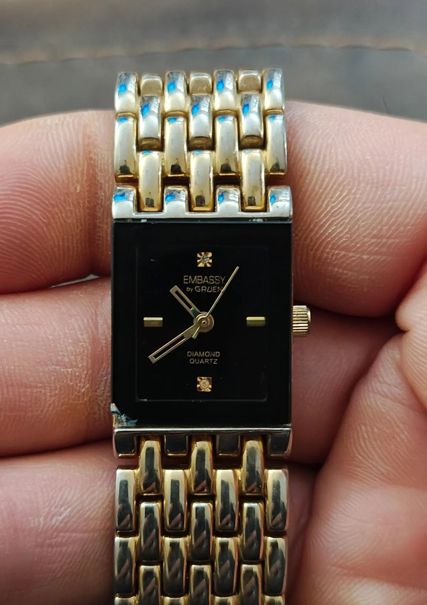 1990s Embassy by Gruen Gold Tone With Black Dial Ladies Diamond Accent Watch