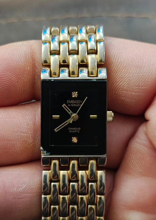 1990s Embassy by Gruen Gold Tone With Black Dial Ladies Diamond Accent Watch