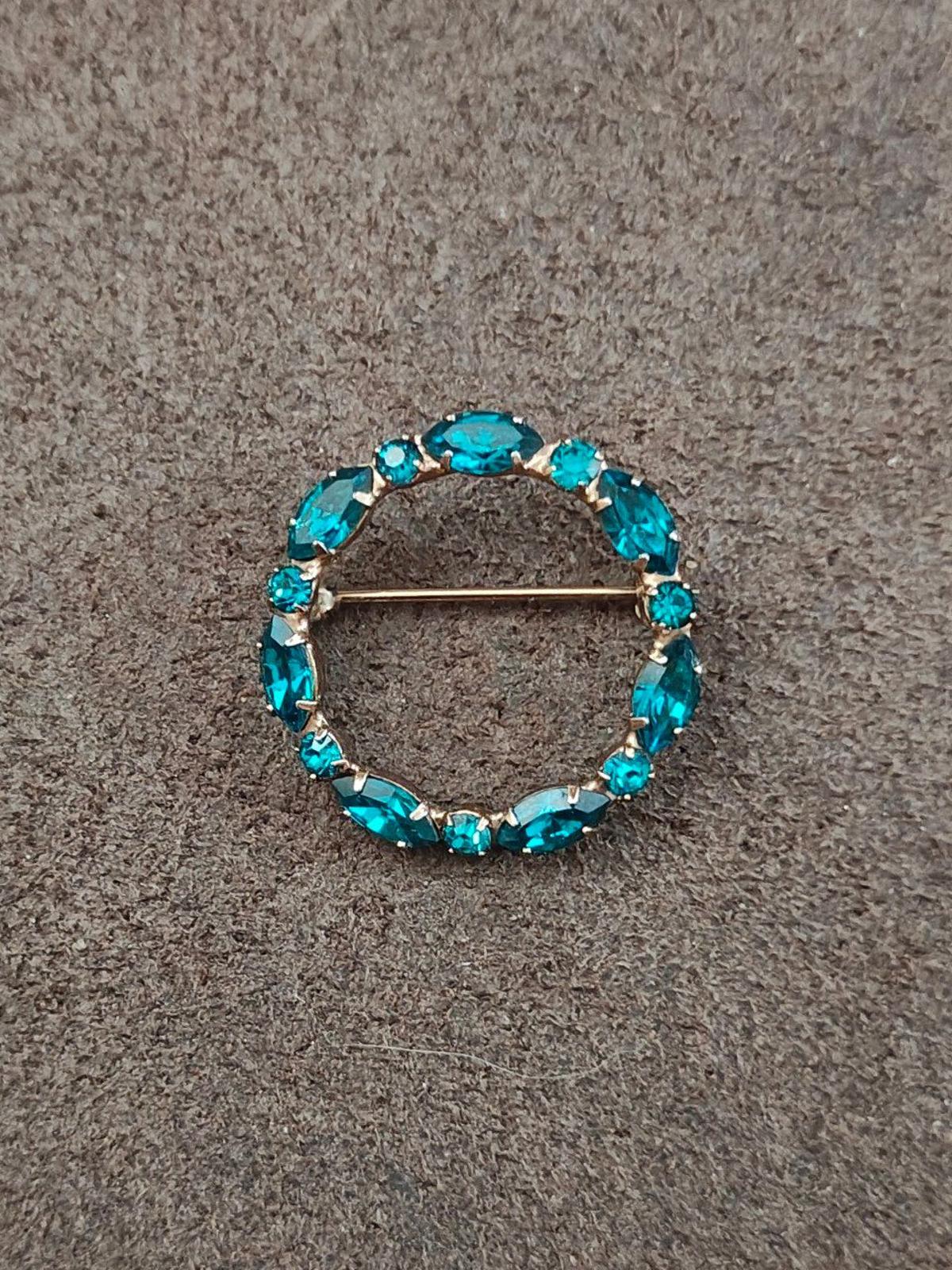 Aqua blue rhinestone round brooch pin with oval stones and gold-tone bar clasp