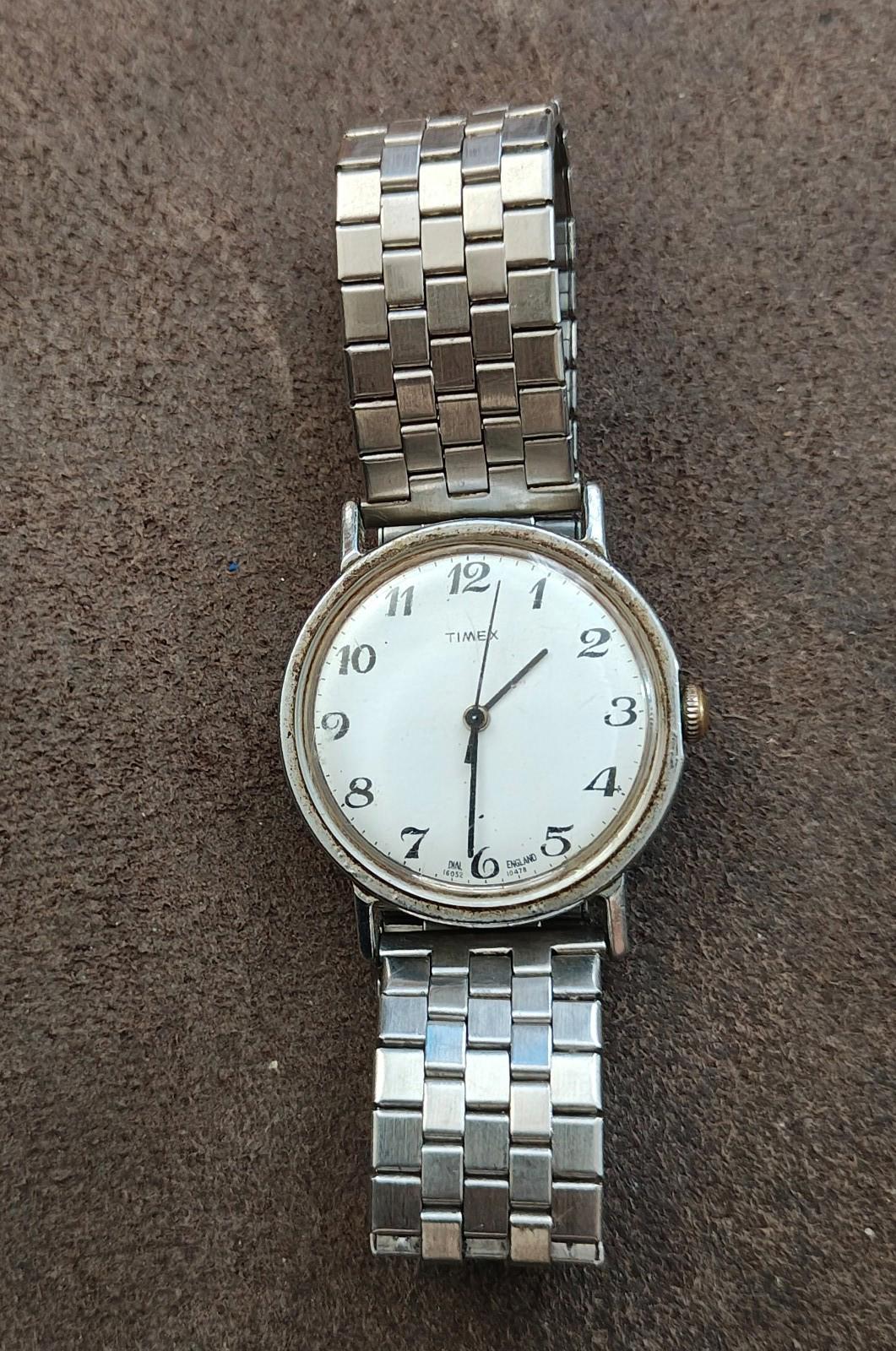 Timex Mercury men’s watch front view with silver dial, Arabic numerals, and metal band