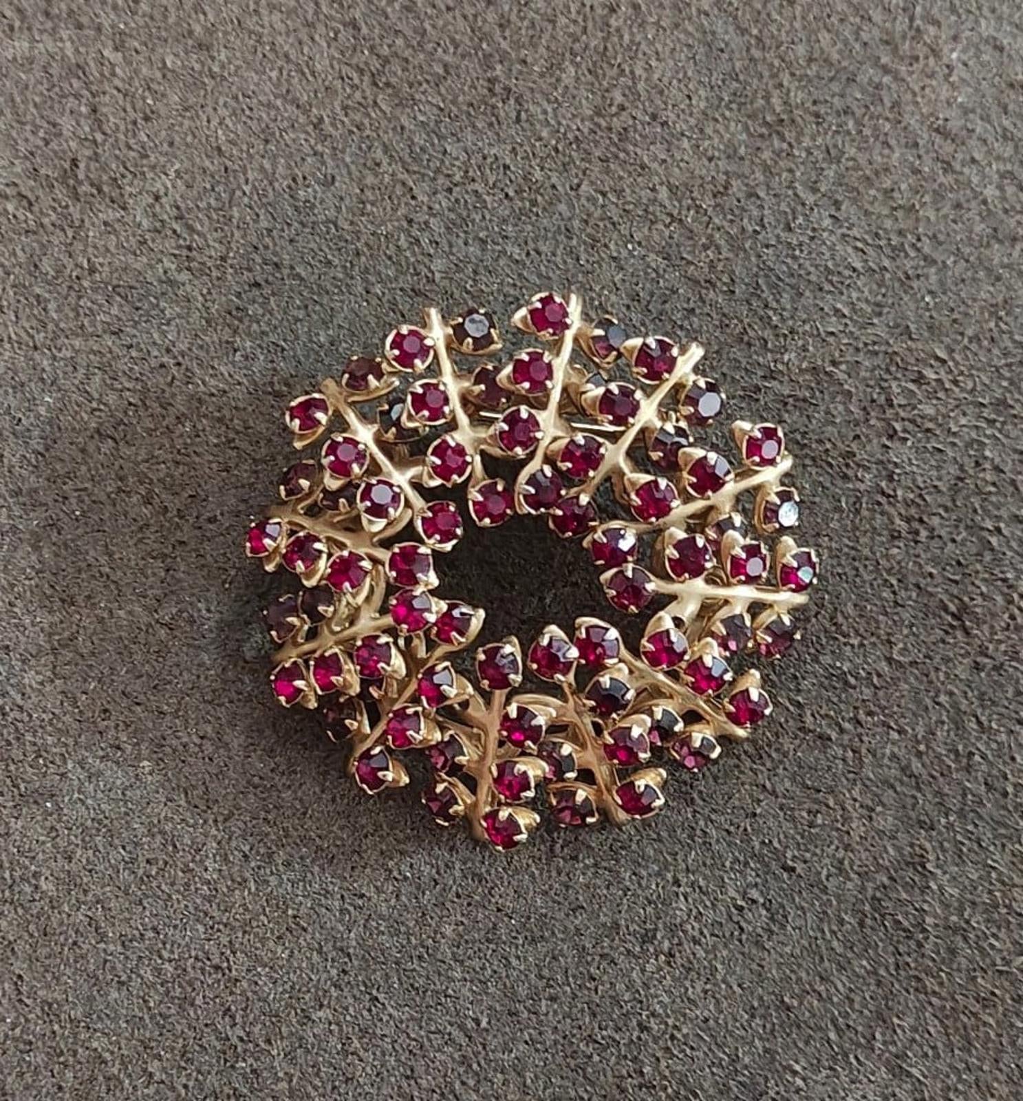 Gold-tone maroon rhinestone brooch pin, round openwork wreath design
