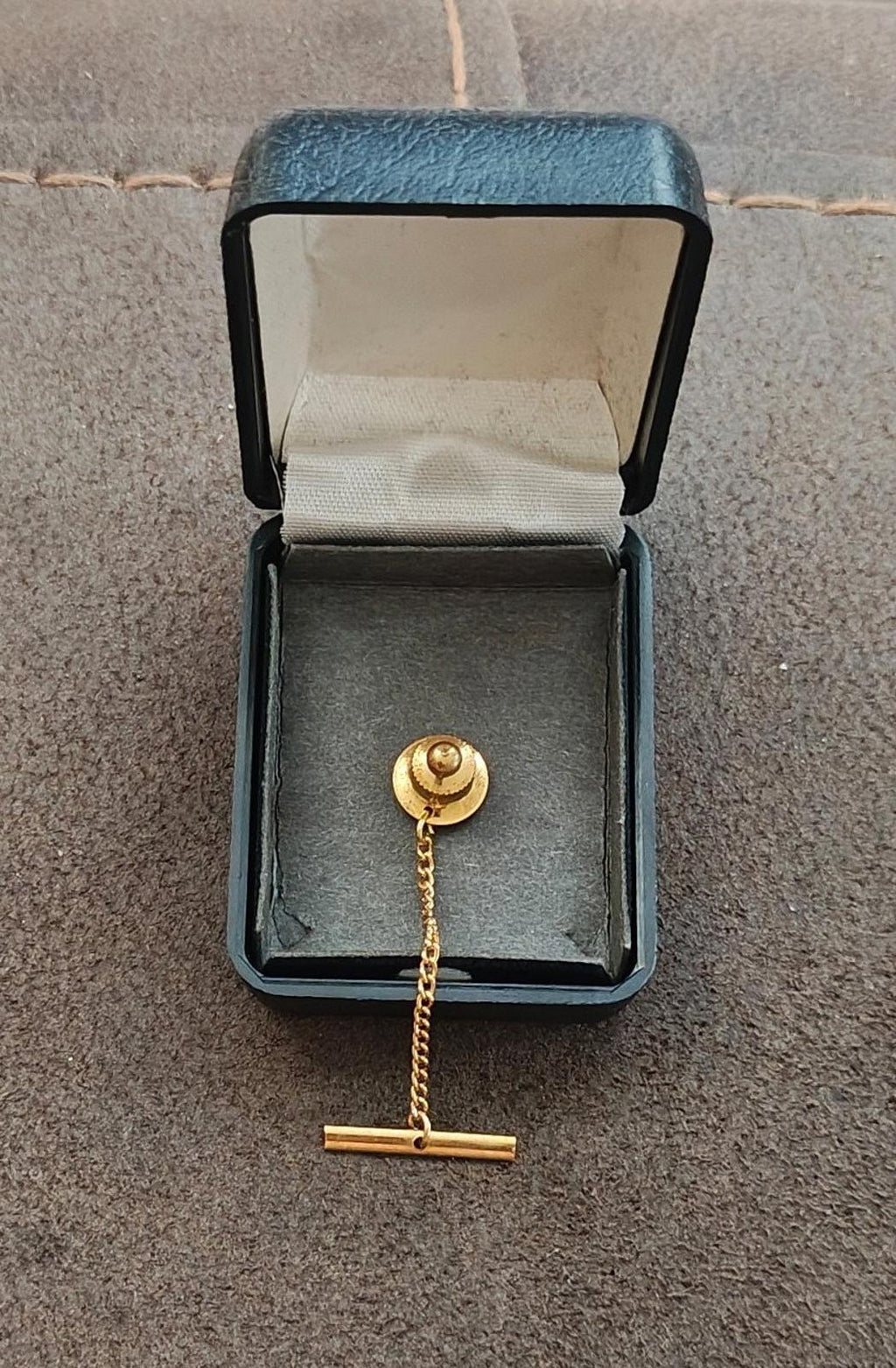 Gold-tone moose tie tack with bar pin and round clasp in box