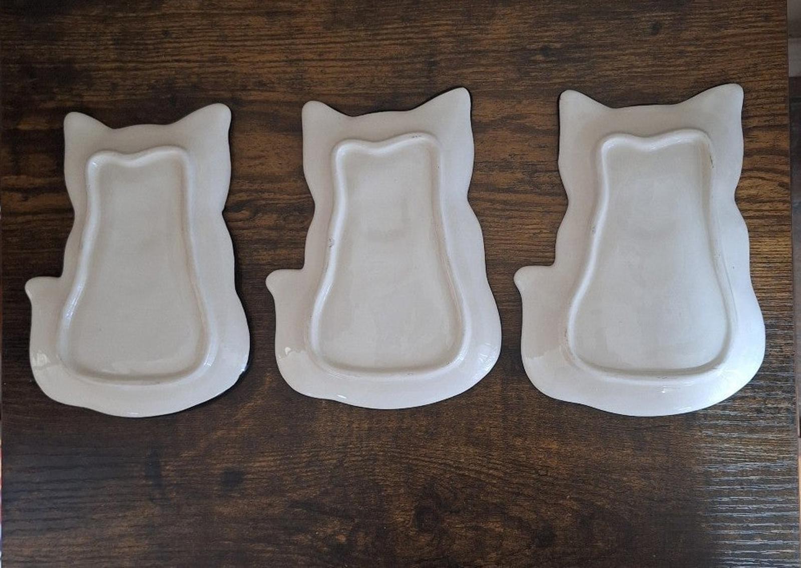 Set of three white 3D cat-shaped trinket plates with smooth back profiles