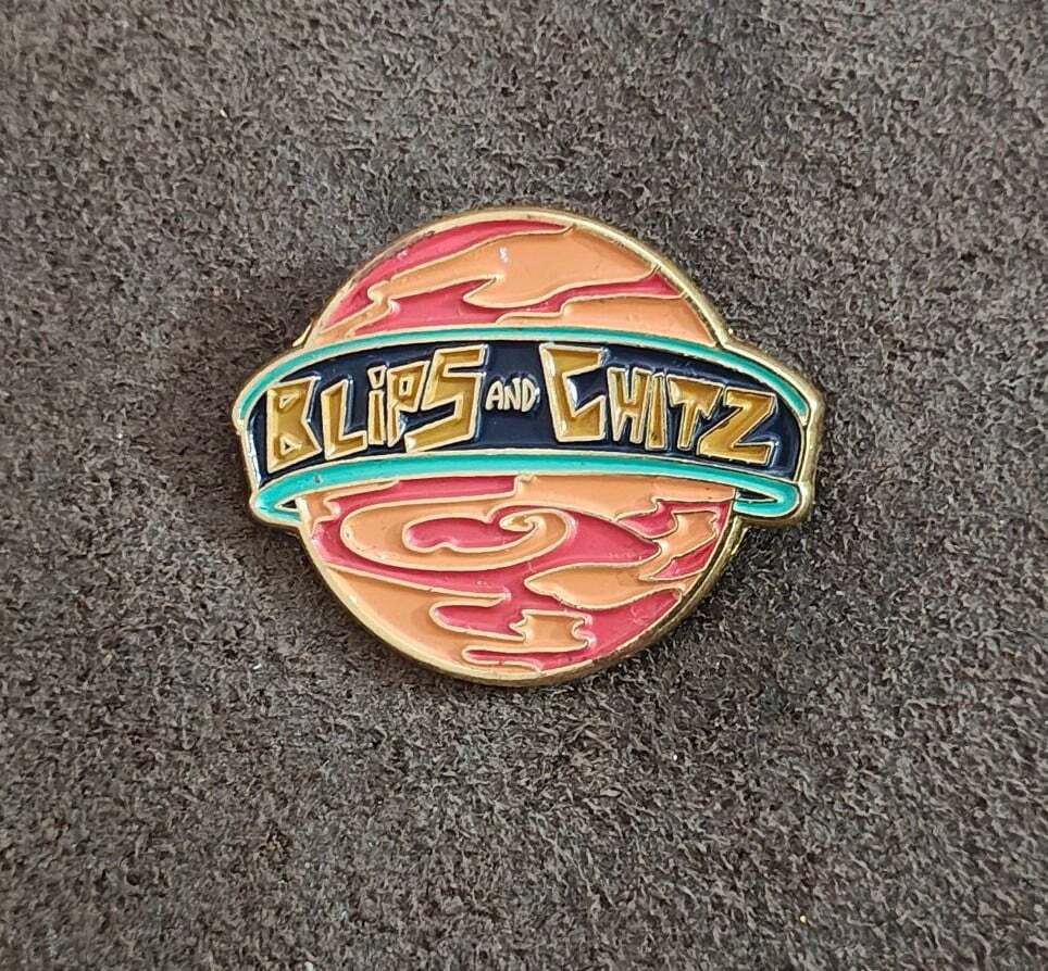 Funko Rick & Morty Blips & Chitz Exclusive Gold Tone Orange Enamel Pin.