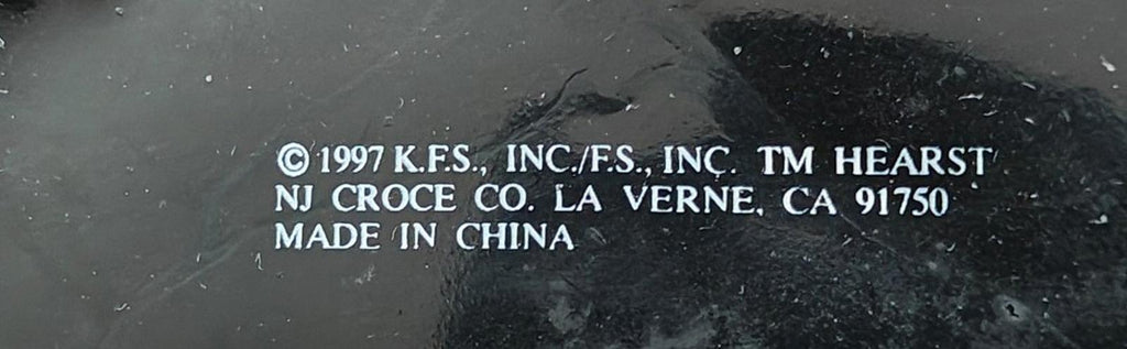Close-up of rubber keychain back showing copyright, trademark, and made in China text