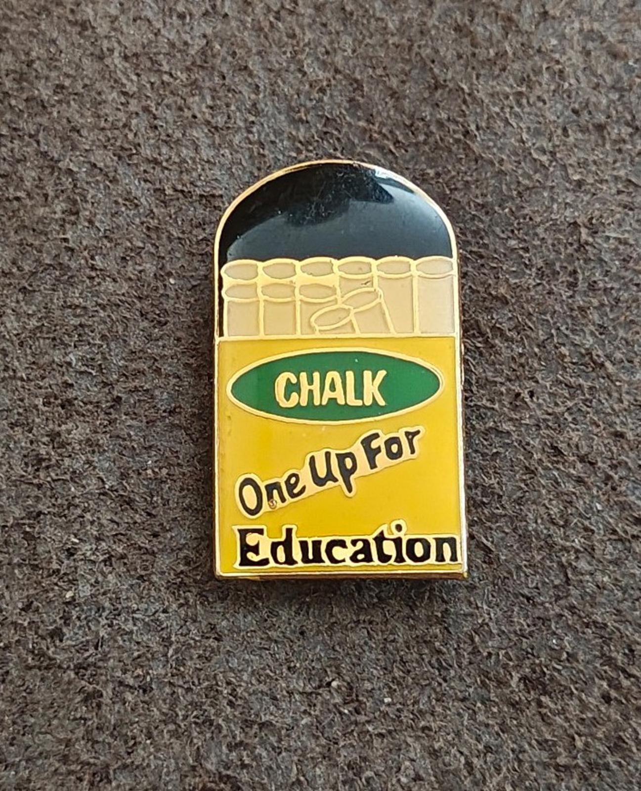 Gold-tone enamel teacher pin front, green “CHALK” band and “One Up For Education” text