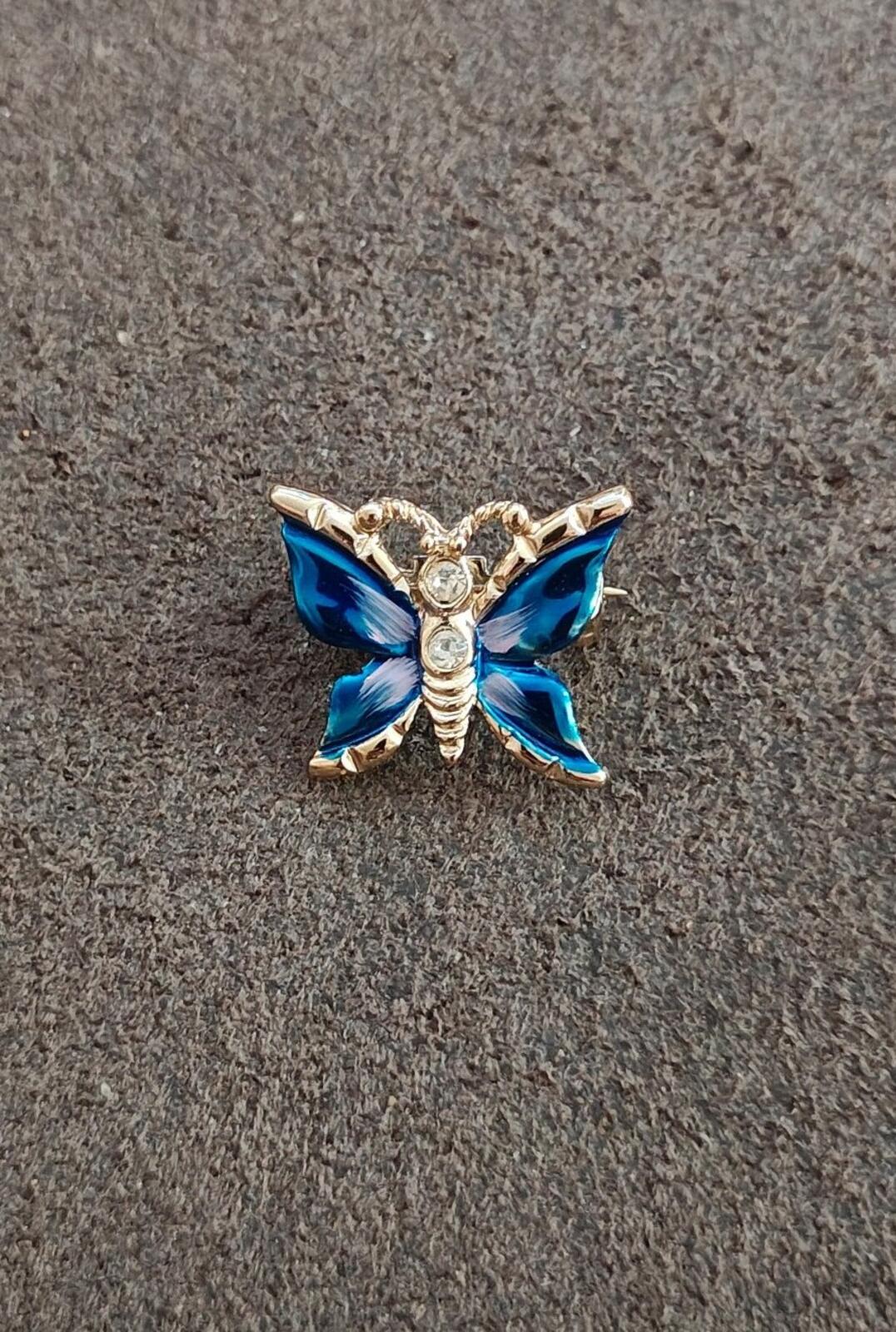 1980s Gold Tone Blue Enamel Butterfly Brooch Accented With Clear Rhinestones