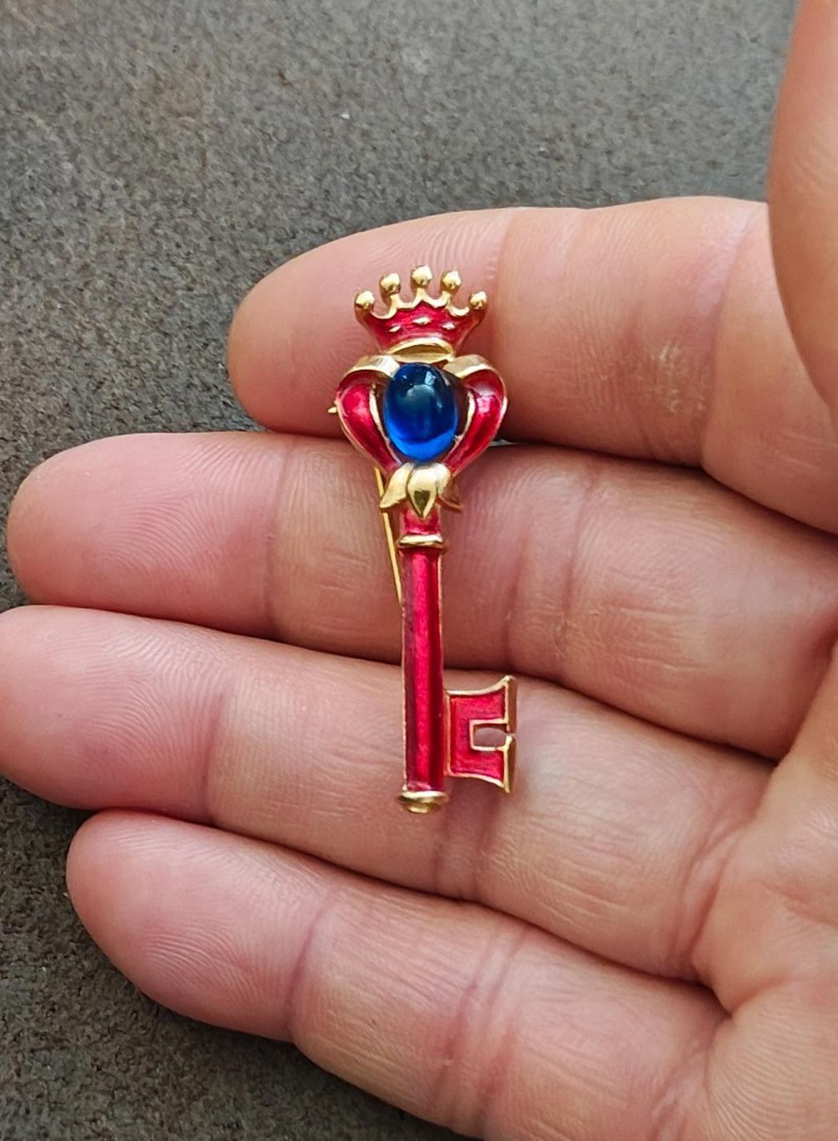 1940s/50s Crown Trifari Gold Tone Key Brooch With Red Enamel and Blue Cabochon