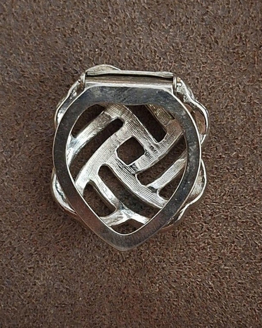 Silver love-knot scarf clip back, lattice pattern above the clasp