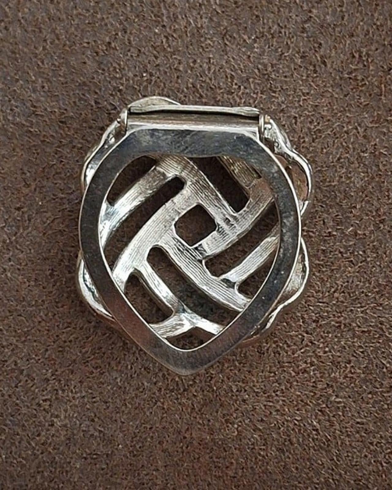 Silver love-knot scarf clip back, lattice pattern above the clasp