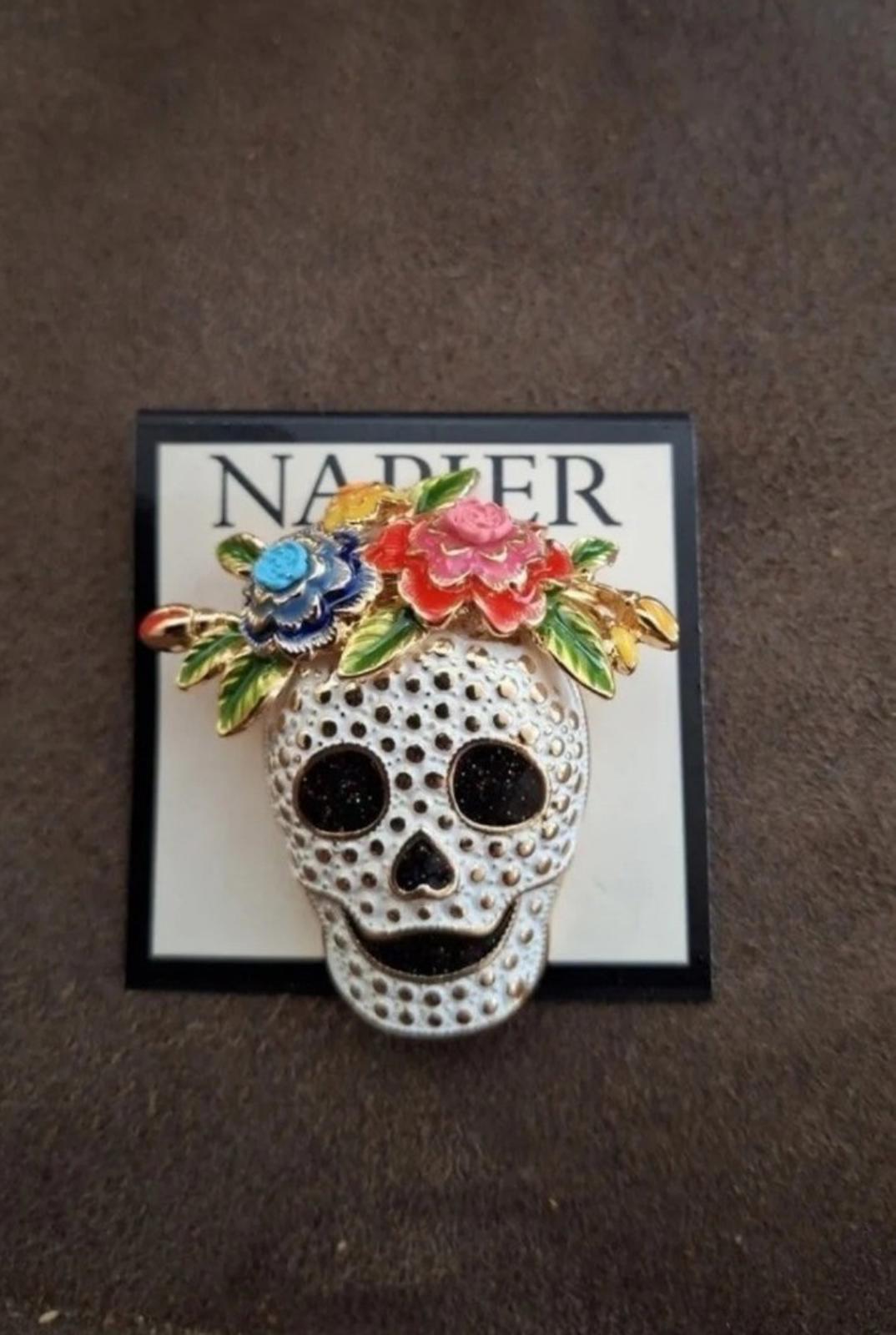 Silver tone sugar skull pin on card with floral crown and black eyes