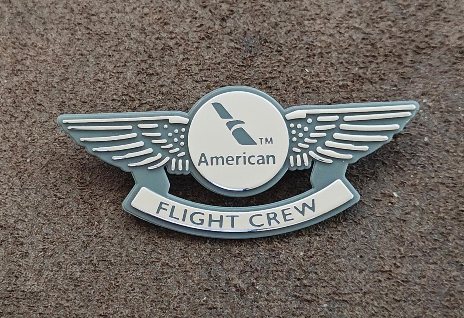 American Flight Crew badge pin, silver wing design with circular American emblem