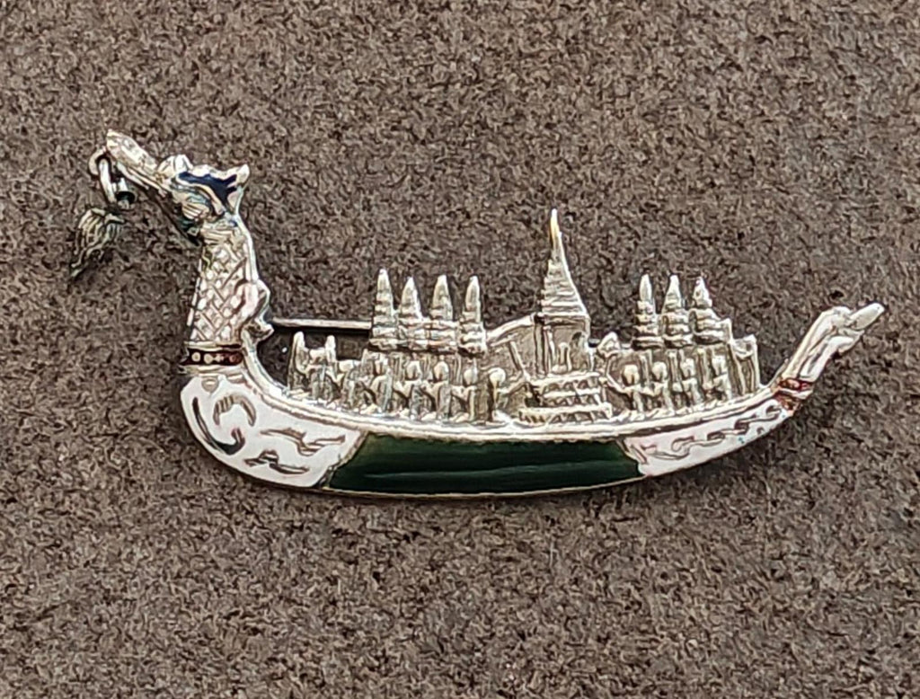 Sterling silver dragon brooch with temple towers, dark green enamel center panel